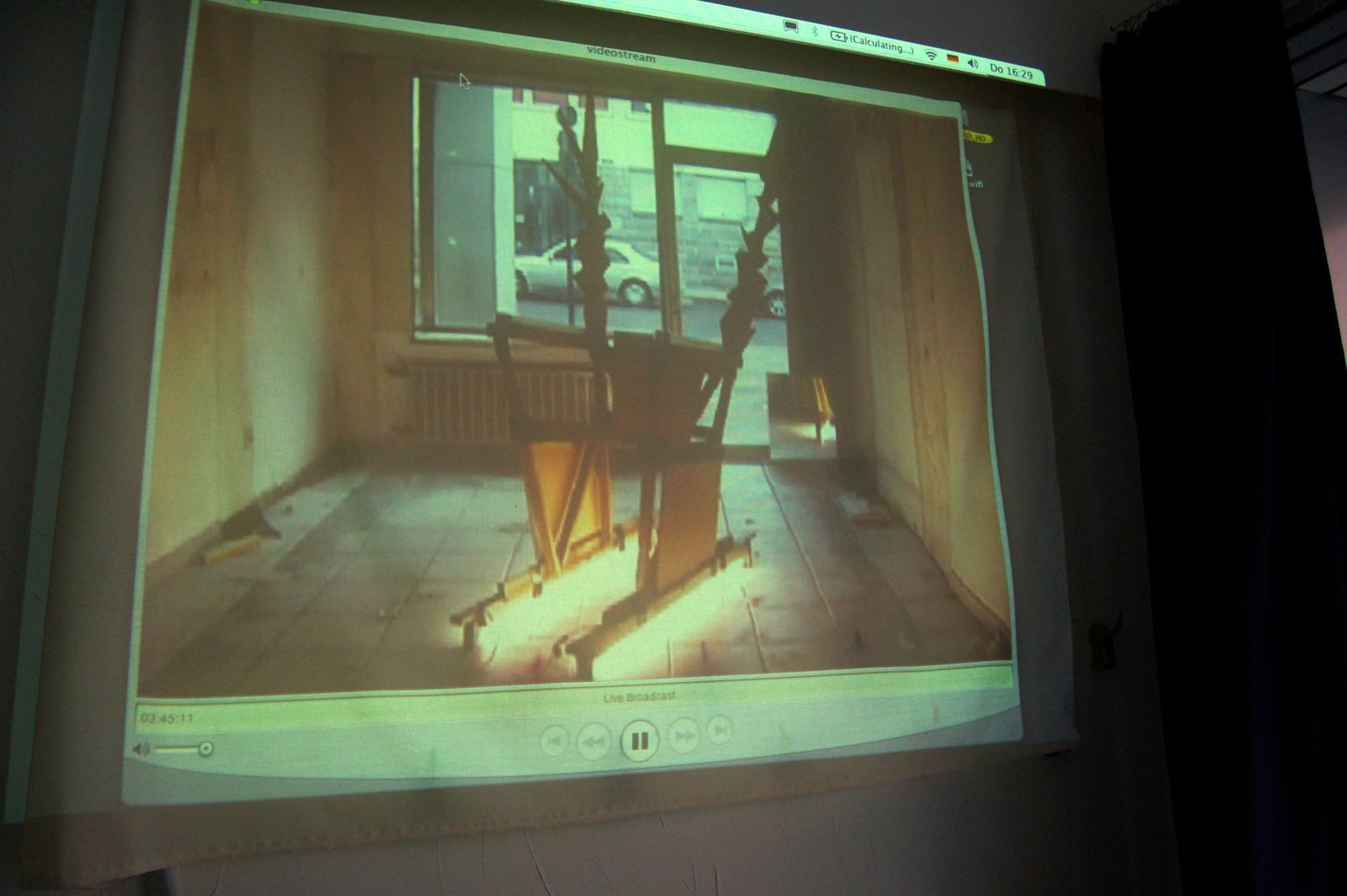 The throne nobody can sit on as a video projection in a darkened room