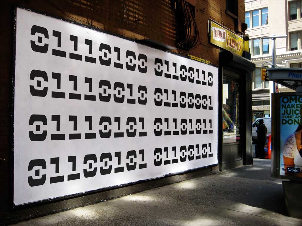 A New York billboard filled with binary code — true / fake